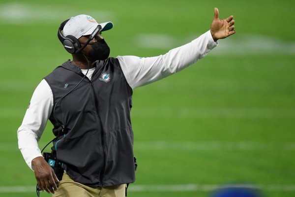 LAS VEGAS, NEVADA - DECEMBER 26: Head coach Brian Flores of the Miami Dolphins watches action during a game against the Las Vegas Raiders at Allegiant Stadium on December 26, 2020 in Las Vegas, Nevada. Harry How/Getty Images/AFP
