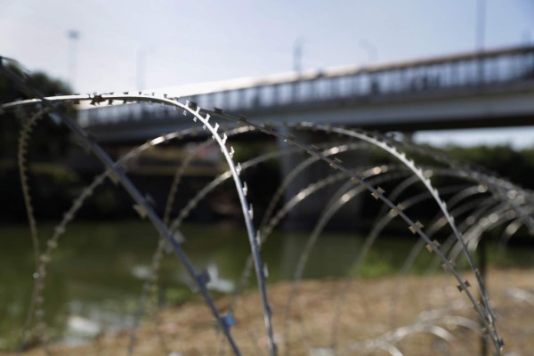 HIDALGO, TX - NOVEMBER 02: Protective wire stretches along the Rio Grande after being installed by U.S. Army troops at the U.S.-Mexico border on November 2, 2018 in Hidalgo, Texas. U.S. President Donald Trump ordered the troops to the border to bolster security at points of entry where an immigrant caravan may attempt to cross into the United States in upcoming weeks. John Moore/Getty Images/AFP