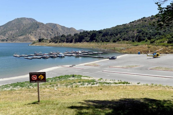 PIRU, CALIFORNIA - JULY 13: A view of Lake Piru during a press conference held for missing actress Naya Rivera on July 13, 2020 in Piru, California. Rivera, known for her role in 'Glee,' was reported missing July 8 after her four-year-old son, Josey, was found alone in a boat rented by Rivera. The Ventura County Sheriffs Department is coordinating a search and recovery operation. Kevin Winter/Getty Images/AFP