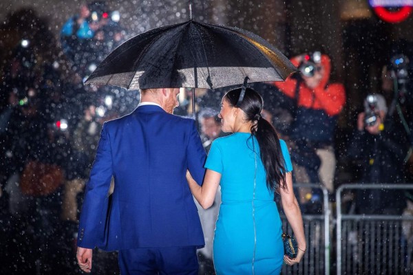 (FILES) In this file photo taken on March 5, 2020 Britain's Prince Harry (L), Duke of Sussex, and Meghan, Duchess of Sussex arrive to attend the Endeavour Fund Awards at Mansion House in London. - Prince Harry and Meghan Markle filed a lawsuit July 23 in Los Angeles against one or more paparazzi whom they accuse of taking pictures of their son without permission, their lawyer told AFP. (Photo by JUSTIN TALLIS / AFP)