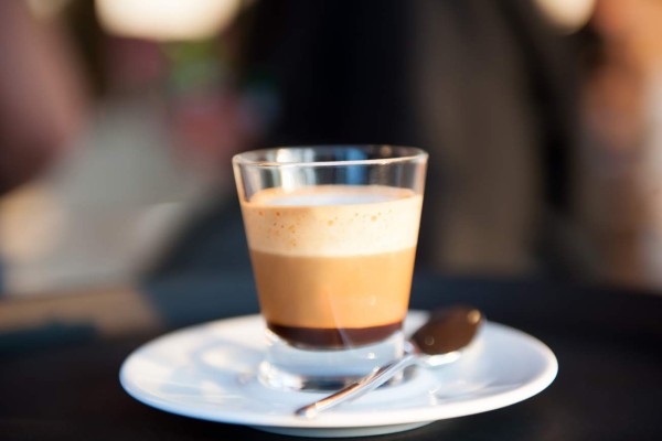 Waiter serving coffee