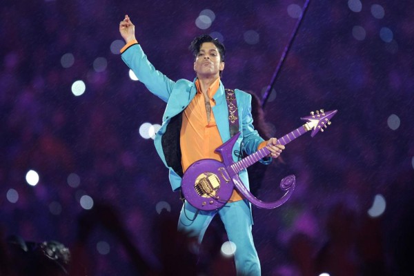 FILE - In this Feb. 4, 2007 file photo, Prince performs during the halftime show at the Super Bowl XLI football game at Dolphin Stadium in Miami. The halftime show has become one of the year's top cultural moments, so anticipated that it is commonly seen by more people than the game itself. (AP Photo/Chris O'Meara, File)