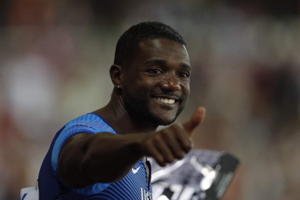 US athlete Justin Gatlin reacts after the heats of the men's 100m athletics event at the 2017 IAAF World Championships at the London Stadium in London on August 4, 2017. / AFP PHOTO / Adrian DENNIS
