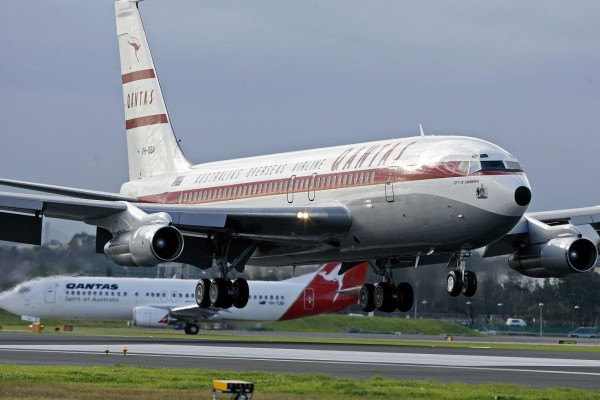 (FILES) A file photo taken on June 7, 2007, shows a Qantas Boeing 707 landing at Sydney International Airport.Hollywood star John Travolta has donated his 'beloved' Boeing 707 plane to an Australian aviation museum and is aiming to be part of the crew to deliver the vintage aircraft down under. Made for Qantas Airways in 1964, Travolta acquired the Boeing 707 long after Australia's national carrier retired the jet. / AFP PHOTO / TORSTEN BLACKWOOD