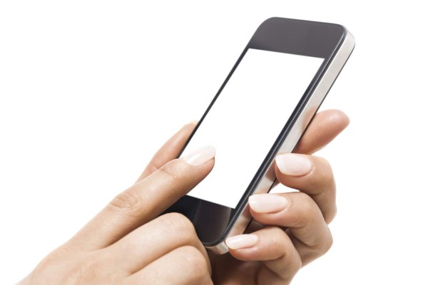 Female hands using smart phone with blank white screen