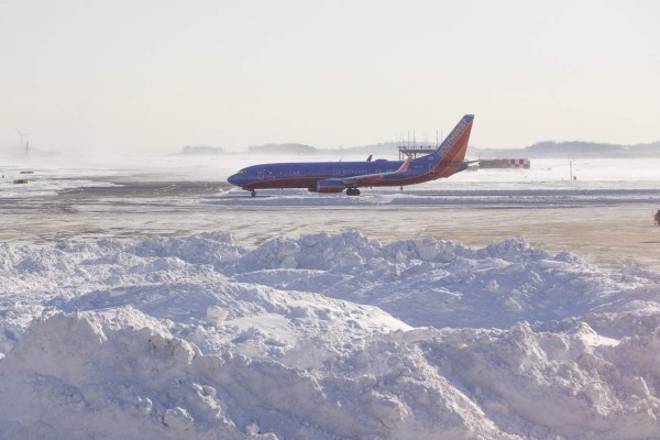 BOSTON, MA - JANUARY 05: A Southwest Airlines airplane navigates a snowy and icy Logan International Airport following a 'bomb cyclone' the previous day on January 5, 2018 in Boston, Massachusetts. Hundreds of flights were cancelled and delayed because of the storm. Scott Eisen/Getty Images/AFP