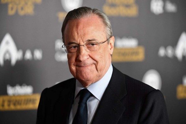 (FILES) In this file photo taken on December 3, 2018 Real Madrid's president Florentino Perez poses upon arrival at the 2018 Ballon d'Or award ceremony at the Grand Palais in Paris. - Twelve of Europe's most powerful clubs announced the launch of a breakaway European Super League on April 19, 2021 in a potentially seismic shift in the way football is run, but faced accusations of greed and cynicism. Six Premier League teams, Liverpool, Manchester United, Arsenal, Chelsea, Manchester City and Tottenham are involved, alongside Real Madrid, Barcelona, Atletico Madrid, Juventus, Inter Milan and AC Milan. Real Madrid chief Florentino Perez, who was announced as the first ESL president, said the breakaway reflected the big clubs' wishes. (Photo by FRANCK FIFE / AFP)