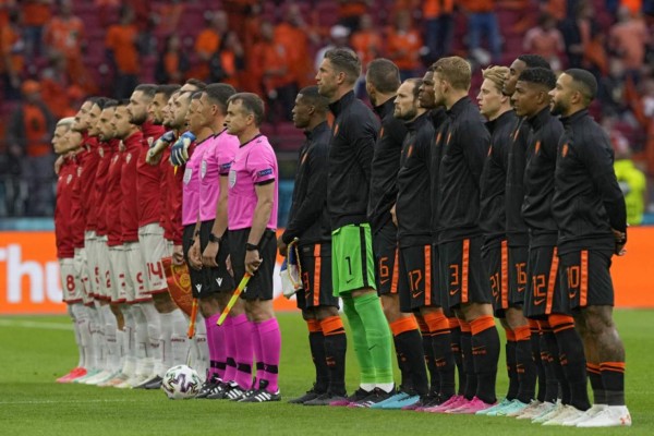 Teams listen to their national anthems before the UEFA EURO 2020 Group C football match between North Macedonia and the Netherlands at Johan Cruyff Arena in Amsterdam on June 21, 2021. (Photo by Peter Dejong / POOL / AFP)