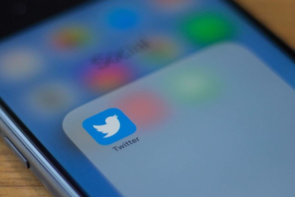 (FILES) In this file photo taken on July 10, 2019 The Twitter logo is seen on a phone in this photo illustration in Washington, DC, on July 10, 2019. - A series of erratic and offensive messages appearing on the account of Twitter chief executive Jack Dorsey August 30, 2019 suggest his account had been hacked. The tweets containing racial slurs and suggestions about a bomb showed up around 2000 GMT on the @jack account of the founder of the short messaging service. The company did not immediately respond to an AFP query. (Photo by Alastair Pike / AFP)