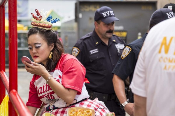 NEW YORK, NY - JULY 04: Competitive eater Mary Bowers looks in a compact mirror before the start of the 2017 Nathan's Famous International Hot Dog Eating Contest at Coney Island on July 4, 2017 in the Brooklyn borough of New York City. Miki Sudo and Joey Chestnut were declared winners in their divisions. The contest in Coney Island is in it's 101th year. Alex Wroblewski/Getty Images/AFP