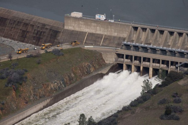 OROVILLE, CA - FEBRUARY 13: The main spillway, which was damaged earlier this week, is seen in use from the air on February 13, 2017 in Oroville, California. Almost 200,000 people were ordered to evacuate the northern California town after a hole in an emergency spillway in the Oroville Dam threatened to flood the surrounding area. Elijah Nouvelage/Getty Images/AFP== FOR NEWSPAPERS, INTERNET, TELCOS & TELEVISION USE ONLY ==