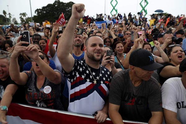 PEMBROKE PINES, FL - NOVEMBER 05: Supporters look on as Democratic preisidential nominee former Secretary of State Hillary Clinton speaks during a campaign rally at C.B. Smith Park on November 5, 2016 in Pembroke Pines, Florida. With three days to go until election day, Hillary Clinton is campaigning in Florida and Pennsylvania. Justin Sullivan/Getty Images/AFP== FOR NEWSPAPERS, INTERNET, TELCOS & TELEVISION USE ONLY ==