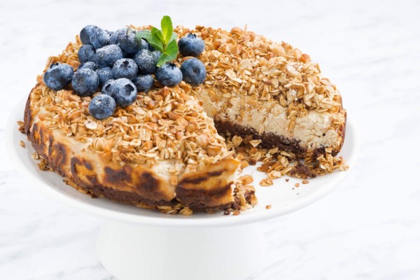 cheese pie with oat flakes on a stand, closeup
