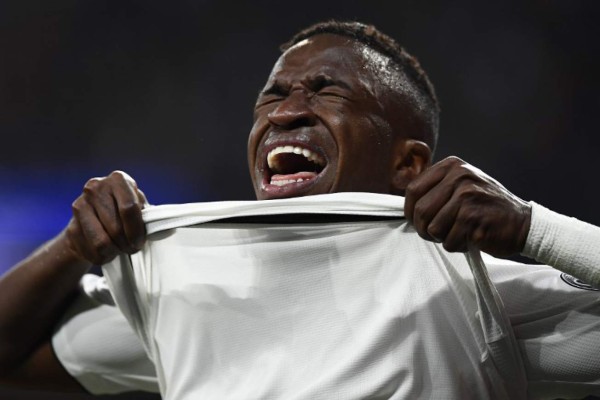 Real Madrid's Brazilian forward Vinicius Junior reacts as he walks off the pitch after getting injured during the UEFA Champions League round of 16 second leg football match between Real Madrid CF and Ajax at the Santiago Bernabeu stadium in Madrid on March 5, 2019. (Photo by GABRIEL BOUYS / AFP)