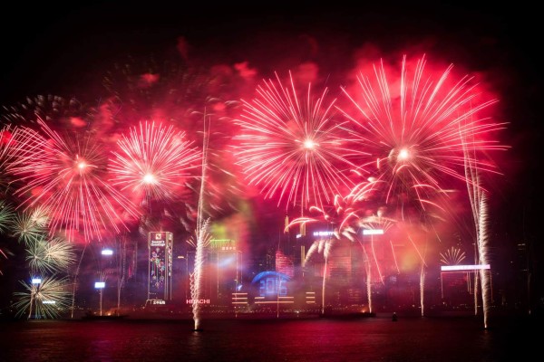 Fireworks are seen over the city's skyline in Hong Kong on January 1, 2016 as part of the 2016 new year celebrations. AFP PHOTO / Philippe Lopez