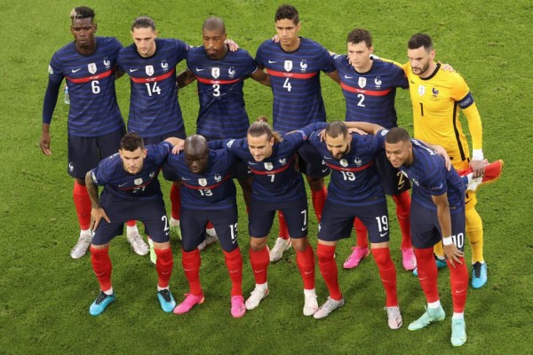 France's starting XI; (L-R top) France's midfielder Paul Pogba, France's midfielder Adrien Rabiot, France's defender Presnel Kimpembe, France's defender Raphael Varane, France's defender Benjamin Pavard and France's goalkeeper Hugo Lloris (L-R bottom) France's defender Lucas Hernandez, France's midfielder N'Golo Kante, France's forward Antoine Griezmann, France's forward Karim Benzema and France's forward Kylian Mbappe pose for the official photograph at the start of the UEFA EURO 2020 Group F football match between France and Germany at the Allianz Arena in Munich on June 15, 2021. (Photo by ALEXANDER HASSENSTEIN / POOL / AFP)
