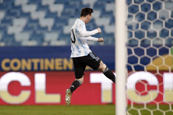 Argentina's Lionel Messi celebrates after scoring against Bolivia during the Conmebol Copa America 2021 football tournament group phase match, at the Arena Pantanal Stadium in Cuiaba, Brazil, on June 28, 2021. (Photo by SILVIO AVILA / AFP)