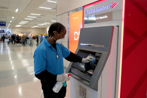 DALLAS, TX - MARCH 13: Hardy Williams works to disinfect areas of the international arrivals terminal at Dallas/Fort Worth International Airport (DFW) on March 13, 2020 in Dallas, Texas. Today was the last day for travelers from 26 European nations to fly into the United States after President Donald Trump instituted a 30-day travel ban in an attempt to stem the proliferation of the COVID-19 pandemic. Tom Pennington/Getty Images/AFP== FOR NEWSPAPERS, INTERNET, TELCOS & TELEVISION USE ONLY ==