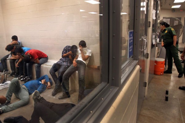MCALLEN, TX - JULY 15, 2014: Immigrants who have been caught crossing the border illegally are housed inside the McAllen Border Patrol Station July 15, 2014 in McAllen, Texas where they are processed. The detainees are both men and women, and range in age from infants to adults. More than 350 were being held here on Tuesday, July 15, 2014. Detainees are mostly separated by gender and age, except for infants. More than 57,000 unaccompanied children have been apprehended at the southwestern border since October, more than twice the total this time last year, many through the Rio Grande Valley. Many are fleeing growing violence in Central America. (Photo by Rick Loomis / Los Angeles Times via Getty Images)