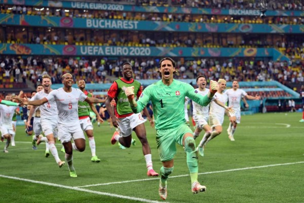 Switzerland's goalkeeper Yann Sommer reacts after saving a shot by France's forward Kylian Mbappe in the penalty shootout during the UEFA EURO 2020 round of 16 football match between France and Switzerland at the National Arena in Bucharest on June 28, 2021. (Photo by Justin Setterfield / POOL / AFP)