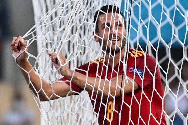 Spain's midfielder Koke gestures in the net during the UEFA EURO 2020 Group E football match between Spain and Sweden at La Cartuja Stadium in Sevilla on June 14, 2021. (Photo by PIERRE-PHILIPPE MARCOU / POOL / AFP)