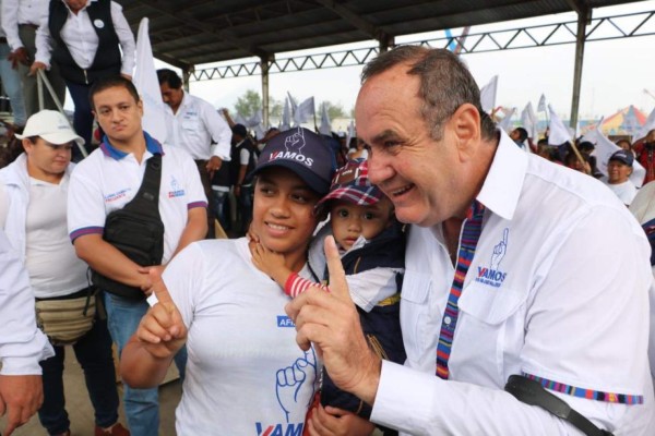 Guatemalan President-elect Alejandro Giammattei smiles during a press conference at the National Theater in Guatemala City on January 13, 2020. - Giammattei will take over on Tuesday as president of Guatemala until 2024 with the challenge of resuming governance to face poverty and corruption, as well as deciding whether to accept Mexicans who are asking for asylum in the United States. (Photo by Orlando ESTRADA / AFP)