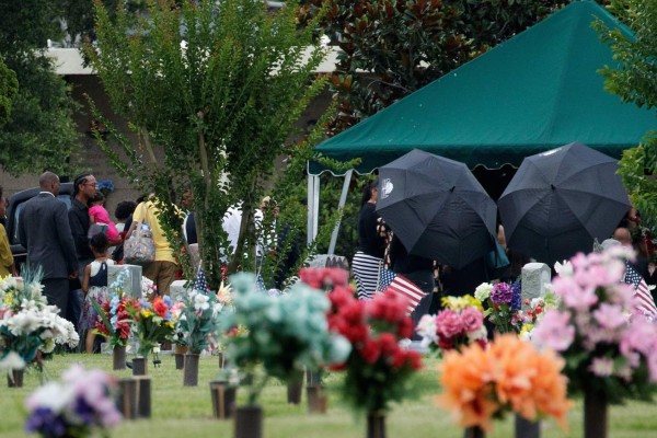 KISSIMMEE, FL - JUNE 16: After the viewing and funeral service, mourners gather at the burial site for Kimberly Morris, June 16, 2016 in Kissimmee, Florida. Morris, who worked as a bouncer at the Pulse Nightclub, was killed in the shooting. The shooting at Pulse Nightclub, which killed 49 people and injured 53, is the worst mass-shooting event in American history. Drew Angerer/Getty Images/AFP== FOR NEWSPAPERS, INTERNET, TELCOS & TELEVISION USE ONLY ==