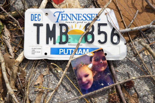 COOKEVILLE, TN - MARCH 03: Detail view of a family photograph and license plate in debris near an apartment complex on March 3, 2020 in Cookeville, Tennessee. A tornado passed through the Nashville area just after midnight leaving a wake of damage in its path including 22 people dead, at least 16 in Putnam County alone. Brett Carlsen/Getty Images/AFP== FOR NEWSPAPERS, INTERNET, TELCOS & TELEVISION USE ONLY ==