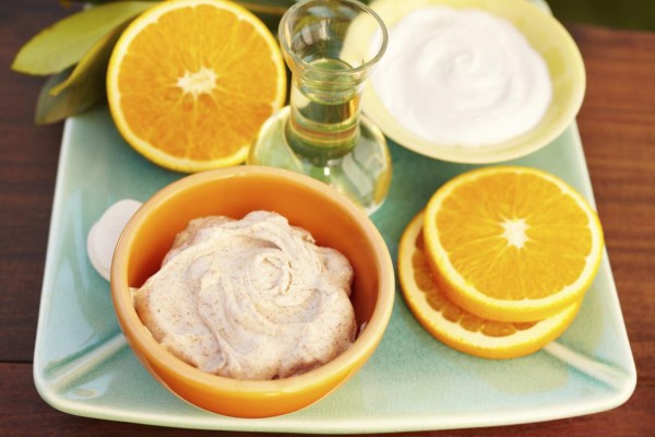 'Spa exfoliation salt scrub, oil massage, moisturizer on a plate, High view.'