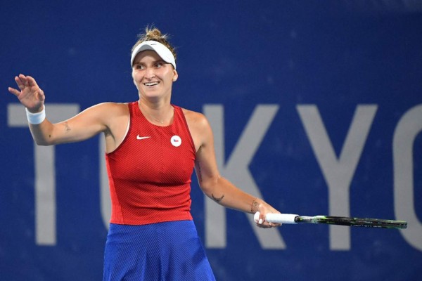 Czech Republic's Marketa Vondrousova celebrates beating Japan's Naomi Osaka in their Tokyo 2020 Olympic Games women's singles third round tennis match at the Ariake Tennis Park in Tokyo on July 27, 2021. (Photo by Tiziana FABI / AFP)
