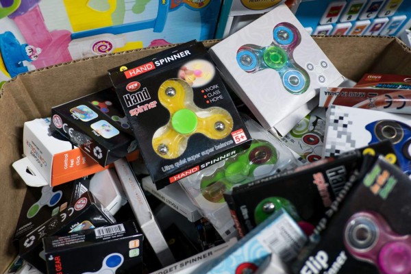 NEW YORK, NY - MAY 5: Fidget spinners sit in a box for sale at a toy shop, May 5, 2017 in the Brooklyn borough of New York City. Fidget spinners have become the latest toy sensation and some schools have banned them because they've become a distraction. Drew Angerer/Getty Images/AFP== FOR NEWSPAPERS, INTERNET, TELCOS & TELEVISION USE ONLY ==