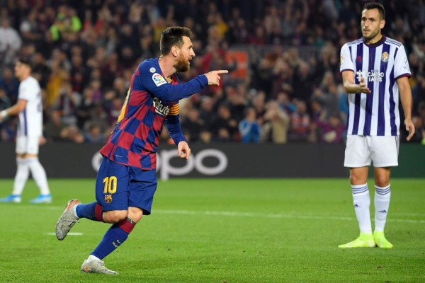 Barcelona's Argentine forward Lionel Messi celebrates after scoring his second goal during the Spanish league football match between FC Barcelona and Real Valladolid FC at the Camp Nou stadium in Barcelona on October 29, 2019. (Photo by LLUIS GENE / AFP)