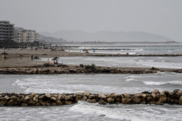 A picture taken on November 7, 2017 shows a series of groynes erected on the Adriatic shore in Qerret, Kavaje.Coastal erosion has advanced fast in this area, bringing down trees planted by the sea shore. Environmentalists say a dangerous mix of climate change and rampant, unregulated urban development are behind the rapid disappearance of the shoreline in the impoverished Balkan country. Of the 427 kilometres (265 miles) of Albania's coast, '154 are affected by erosion', Environment Minister Blendi Klosi told AFP. / AFP PHOTO / Gent SHKULLAKU