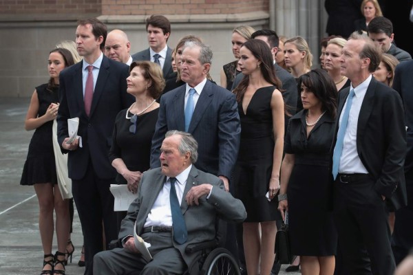 HOUSTON, TX - APRIL 21: Former president George H.W. Bush and son, former president George W. Bush, watch with family as the coffin of former first lady Barbara Bush is placed in a hearse outside of St. Martin's Episcopal Church following her funeral service on April 21, 2018 in Houston, Texas. Bush, wife of former president George H. W. Bush and mother of former president George W. Bush, died at her home in Houston on April 17 at the age of 92. Scott Olson/Getty Images/AFP== FOR NEWSPAPERS, INTERNET, TELCOS & TELEVISION USE ONLY ==