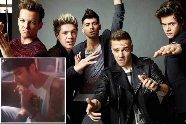 Captan a músicos de One Direction fumando un porro