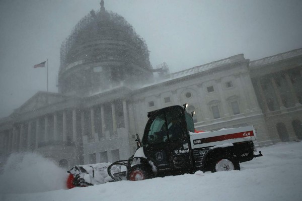 WASHINGTON, DC - JANUARY 23: A snowplow clears snow on the East Front of the U.S. Capitol January 23, 2016 in Washington, DC. Heavy snow continued to fall in the Mid-Atlantic region causing 'life-threatening blizzard conditions' and affecting millions of people. Alex Wong/Getty Images/AFP== FOR NEWSPAPERS, INTERNET, TELCOS & TELEVISION USE ONLY ==