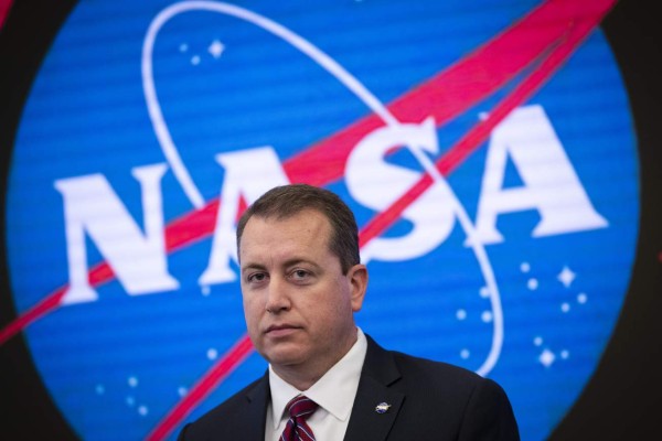 NEW YORK, NY - JUNE 7: NASA Chief Financial Officer Jeff DeWit looks on during a press conference to address the opening of the International Space Station to expanded commercial activities, at the Nasdaq MarketSite, June 7, 2019 in New York City. The efforts are intended to broaden the scope of commercial activity on the space station beyond the ISS National Lab, which is limited to research and development. The International Space Station originally launched into orbit in 1998 and has been continually inhabited since November 2000. Drew Angerer/Getty Images/AFP