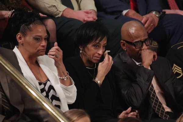 WASHINGTON, DC - JANUARY 30: Elzabeth Alvarado, Evelyn Rodriguez and Freddy Cuevas, parents of children who were murdered by MS-13 watch as U.S. President Donald J. Trump delivers the State of the Union address in the chamber of the U.S. House of Representatives January 30, 2018 in Washington, DC. This is the first State of the Union address given by U.S. President Donald Trump and his second joint-session address to Congress. Alex Wong/Getty Images/AFP== FOR NEWSPAPERS, INTERNET, TELCOS & TELEVISION USE ONLY ==