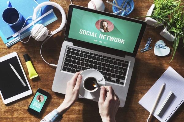 Social network user profile mock up on computer screen, tablet and smartphone