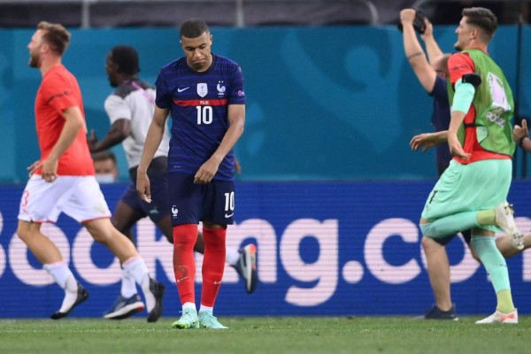 France's forward Kylian Mbappe reacts after missing the final penalty during the UEFA EURO 2020 round of 16 football match between France and Switzerland at the National Arena in Bucharest on June 28, 2021. (Photo by FRANCK FIFE / POOL / AFP)