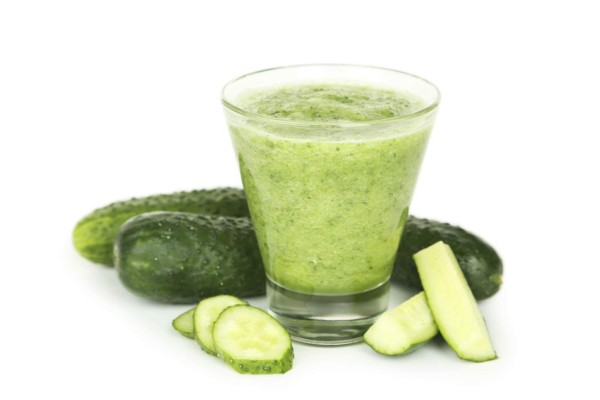 Glass of cucumber juice isolated on white
