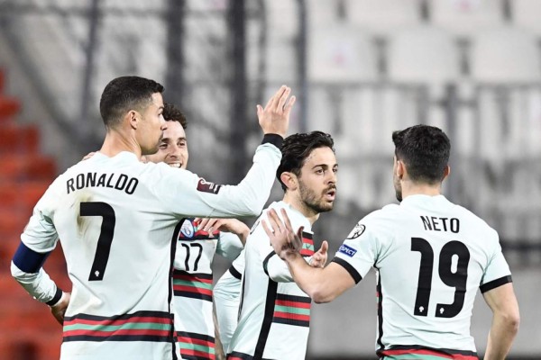 Portugal's forward Diogo Jota (3rd R) celebrates with teammates after scoring a goal during the FIFA World Cup Qatar 2022 qualification Group A football match between Luxembourg and Portugal at the Josy Barthel Stadium, in Luxembourg City, on March 30, 2021. (Photo by JOHN THYS / AFP)