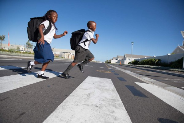 African primary school kids in theirs uniforms going to school. Image from South Africa.