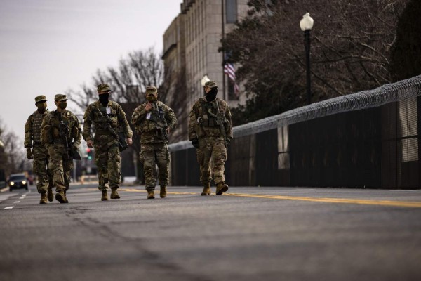 WASHINGTON, DC - JANUARY 15: A group of National Guard soldiers patrol the inner perimeter around the U.S. Capitol on January 15, 2021 in Washington, DC. Due to security threats following last week's storming of the U.S. Capitol by a pro-Trump mob, law enforcement agencies have increased security measures along the National Mall and much of downtown Washington, DC, essentially closing down the Mall a week ahead of President-elect Joe Biden's inauguration. Samuel Corum/Getty Images/AFP== FOR NEWSPAPERS, INTERNET, TELCOS & TELEVISION USE ONLY ==