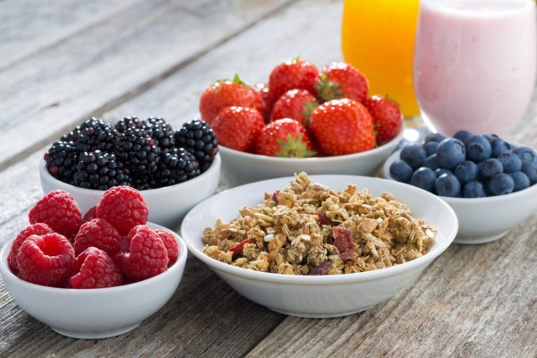 healthy breakfast with berries on wooden background, close-up, horizontal