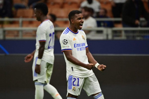 Real Madrid's Brazilian forward Rodrygo celebrates after opening the scoring during the UEFA Champions League Group D football match between Inter Milan and Real Madrid on September 15, 2021 at the San Siro stadium in Milan. (Photo by MIGUEL MEDINA / AFP)