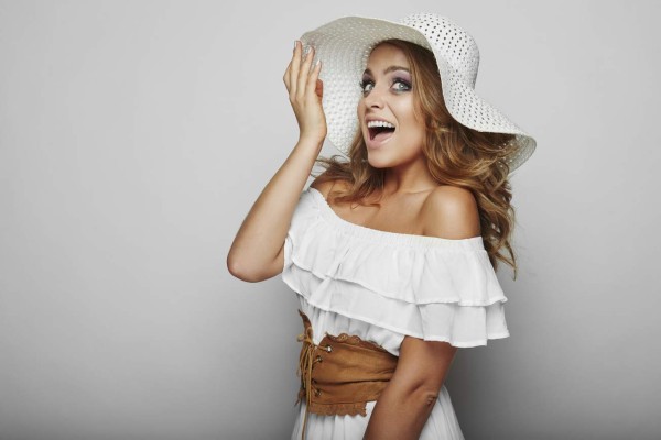 Portrait of beautiful blond woman in white dress