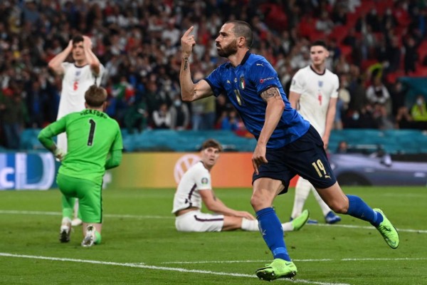 Italy's defender Leonardo Bonucci celebrates scoring the team's first goal during the UEFA EURO 2020 final football match between Italy and England at the Wembley Stadium in London on July 11, 2021. (Photo by Paul ELLIS / POOL / AFP)