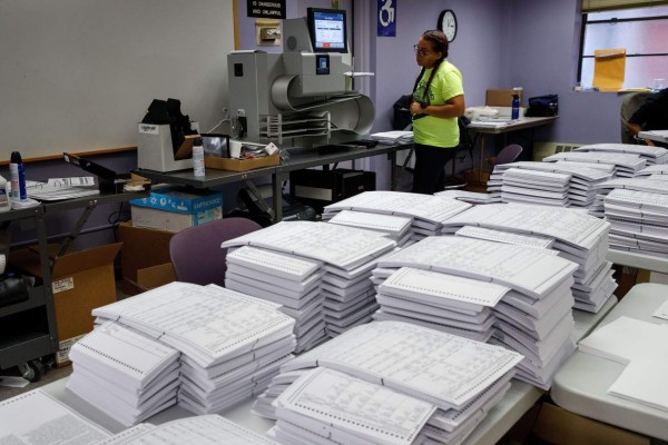 NEW YORK, NY - NOVEMBER 3: Test ballots wait to be scanned at a Board of Elections Elections voting machine facility warehouse, November 3, 2016 in the Bronx borough in New York City. The voting booths, ballot scanners and other supplies will be picked up on Monday and delivered to area Bronx polling places ahead of Tuesday's election. Drew Angerer/Getty Images/AFP== FOR NEWSPAPERS, INTERNET, TELCOS & TELEVISION USE ONLY ==