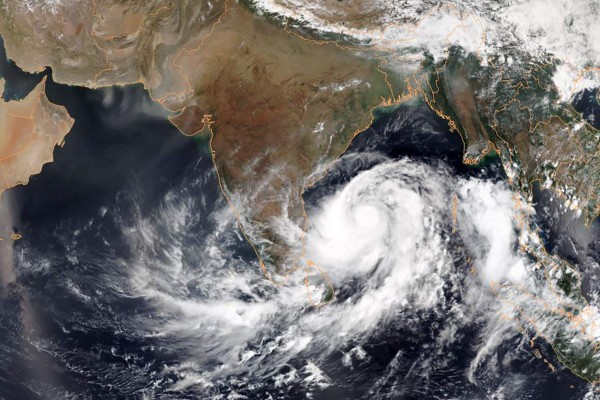 This May 1, 2019, satellite image obtained courtesy of the National Oceanic and Atmospheric Administration (NOAA) shows Tropical Cyclone Fani intensifying in the Bay of Bengal. - India deployed emergency personnel May 1, 2019, and ordered the navy on standby as it braced for an extremely severe cyclonic storm barrelling towards the eastern coast. Tropical Cyclone Fani, located in the Bay of Bengal and packing wind speeds up to 205 kilometres (127 miles) per hour, is expected to make landfall at Odisha state Friday. (Photo by HO / NOAA / AFP) / RESTRICTED TO EDITORIAL USE - MANDATORY CREDIT 'AFP PHOTO / NOAA' - NO MARKETING NO ADVERTISING CAMPAIGNS - DISTRIBUTED AS A SERVICE TO CLIENTS ---